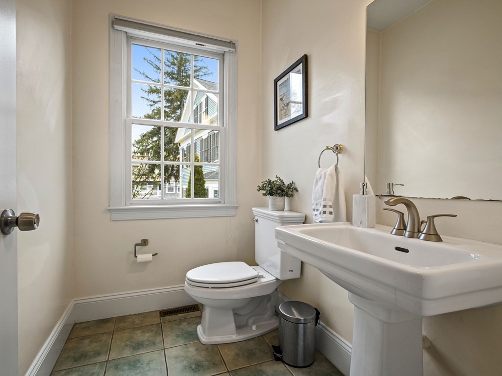 44 A Orchardhill Road, Unit A Boston, MA 02130 - Photo 20 of 37 a bathroom with a sink toilet and a mirror