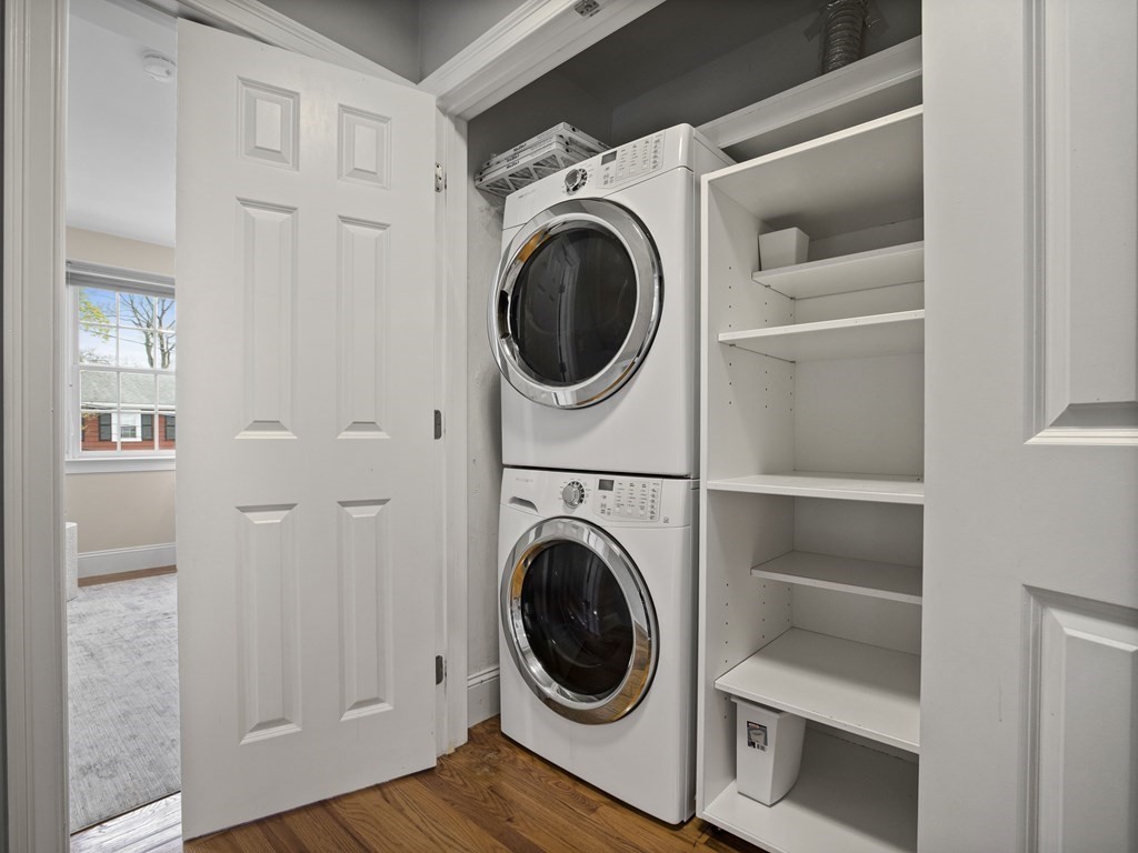44 A Orchardhill Road, Unit A Boston, MA 02130 - Photo 23 of 37 a view of a hallway with washer and dryer