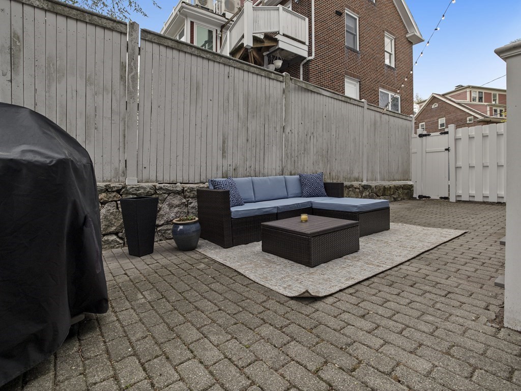 44 A Orchardhill Road, Unit A Boston, MA 02130 - Photo 28 of 37 a view of a patio with table and chairs