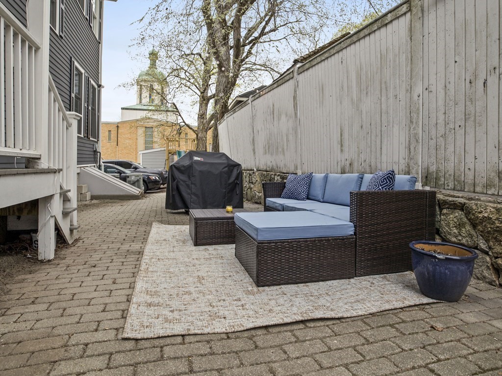 44 A Orchardhill Road, Unit A Boston, MA 02130 - Photo 29 of 37 a view of a patio with table and chairs