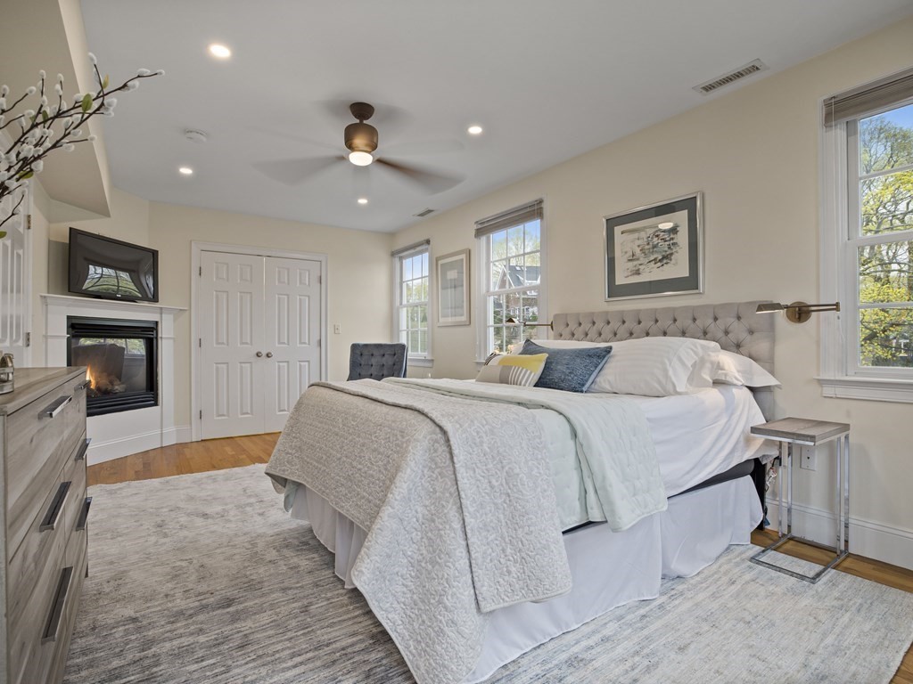 44 A Orchardhill Road, Unit A Boston, MA 02130 - Photo 9 of 37 a spacious bedroom with a large bed and a couch