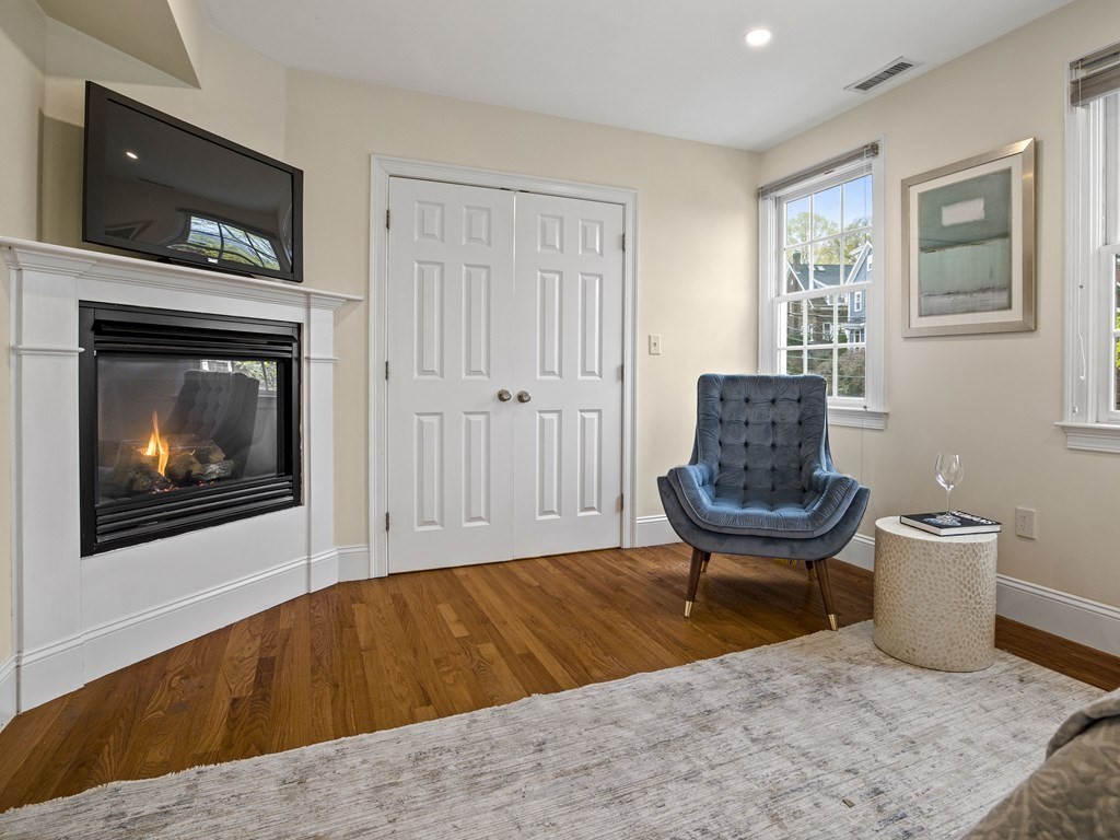 44 A Orchardhill Road, Unit A Boston, MA 02130 - Photo 10 of 37 a living room with furniture and a fireplace