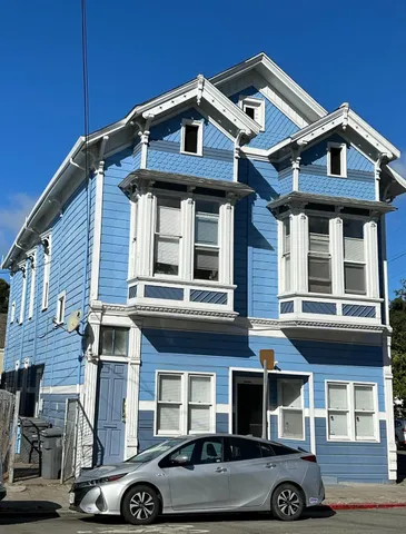 a front view of a house with parking
