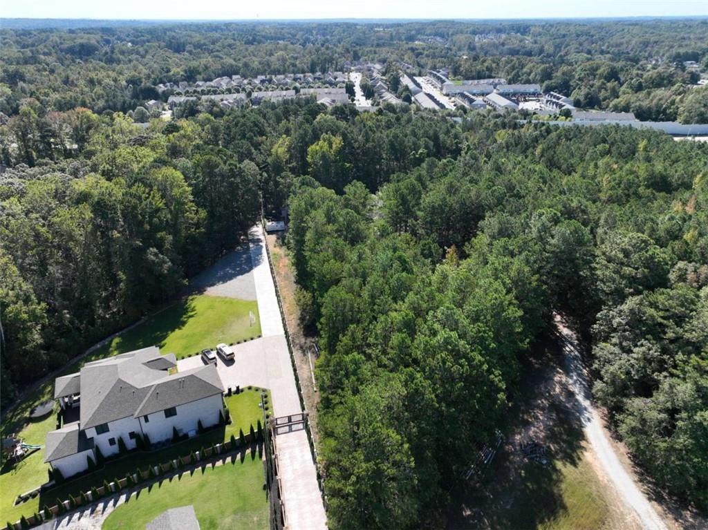 2655 Camp Branch Road Buford, GA 30519 - Photo 8 of 22 an aerial view of house with yard and mountain view in back