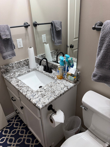 14797 South Chandlerpoint Way Draper, UT 84020 - Photo 27 of 33 Bathroom vanity featuring a white undermount sink and a speckled countertop