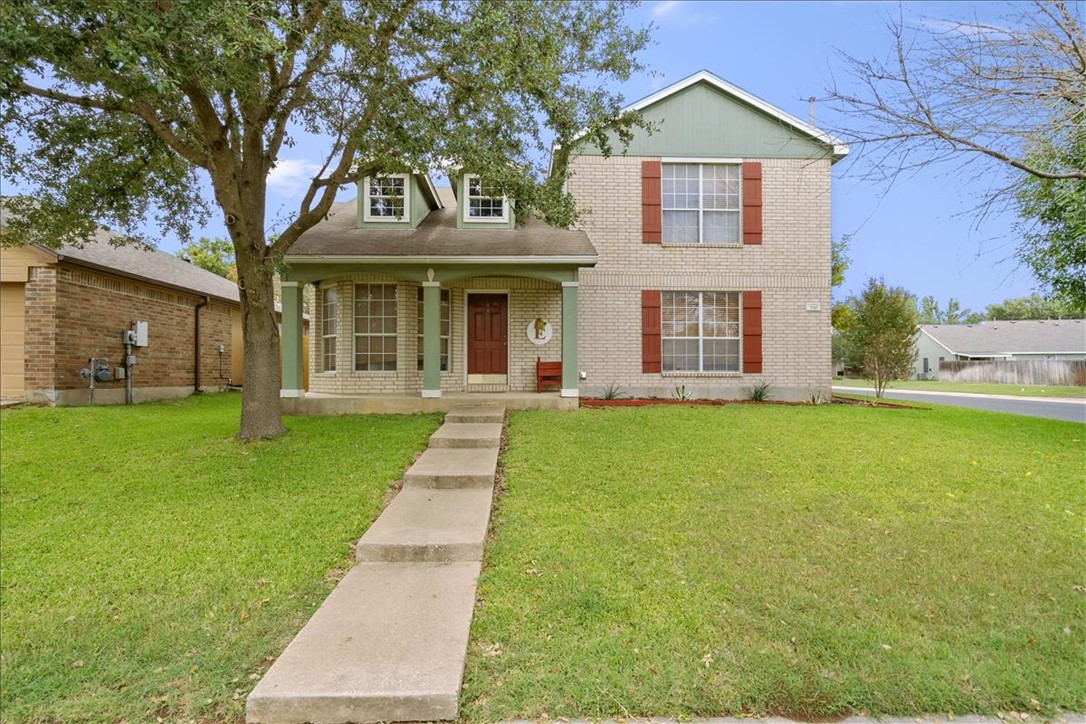 330 Katy Crossing Georgetown, TX 78626 - Photo 1 of 1 a front view of house with yard and green space