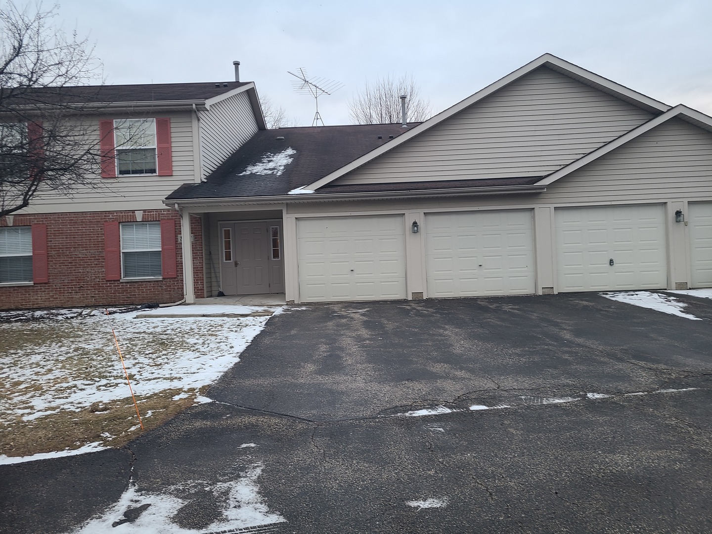 978 North Village Drive, Unit 2 Round Lake Beach, IL 60073 - Photo 1 of 7 a view of garage yard