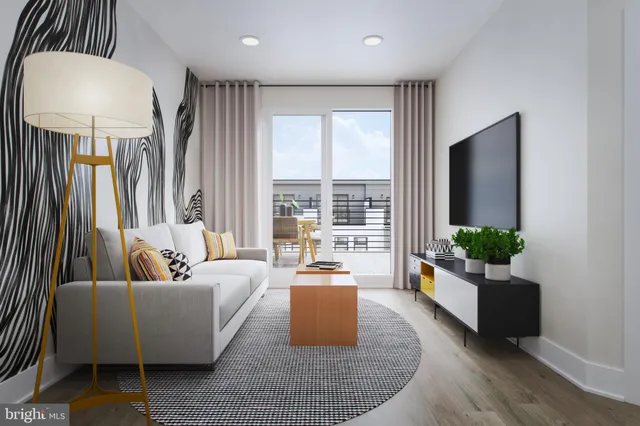 a spacious bedroom with a bed and painting on the wall