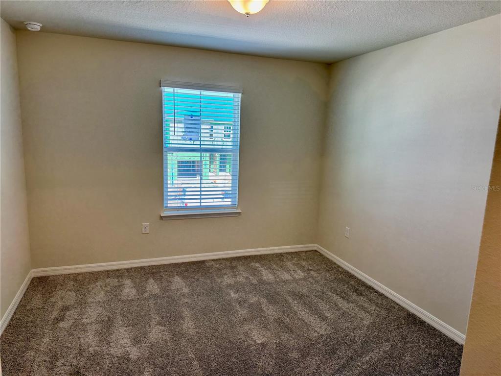 3059 Emerald Acrs Lane Sanford, FL 32771 - Photo 16 of 24 an empty room with a window