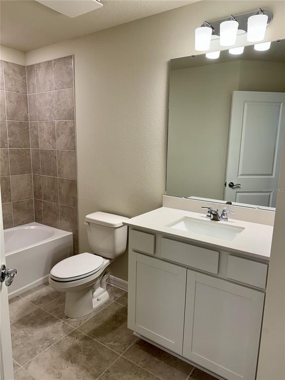 3059 Emerald Acrs Lane Sanford, FL 32771 - Photo 18 of 24 a bathroom with a sink a toilet and shower