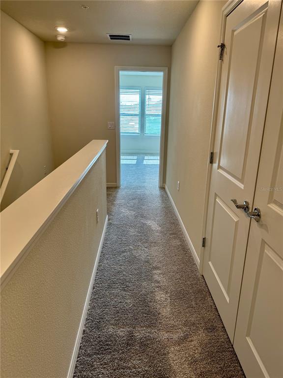 3059 Emerald Acrs Lane Sanford, FL 32771 - Photo 20 of 24 a view of a hallway with a hallway