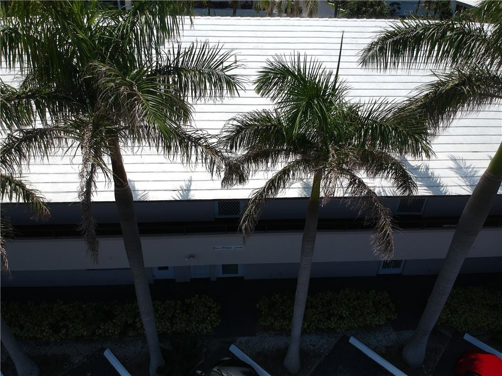 2601 South Ocean Boulevard, Unit 9 Boca Raton, FL 33432 - Photo 23 of 33 a view of swimming pool with a table and chairs