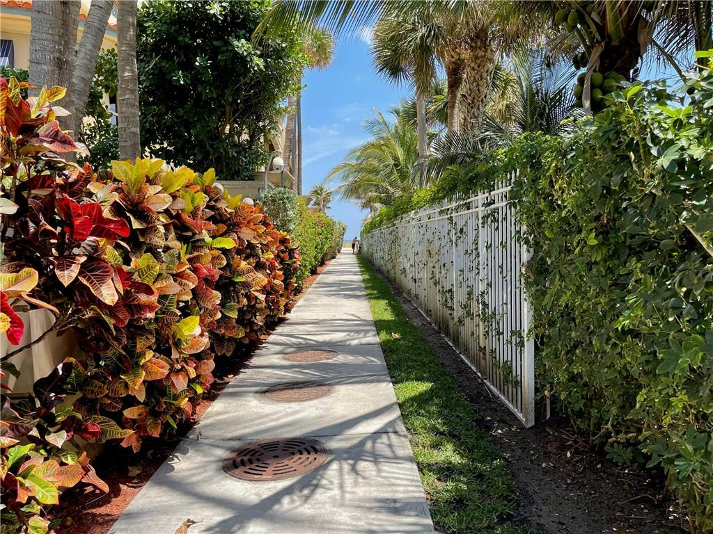 2601 South Ocean Boulevard, Unit 9 Boca Raton, FL 33432 - Photo 28 of 33 a view of a pathway with flowers