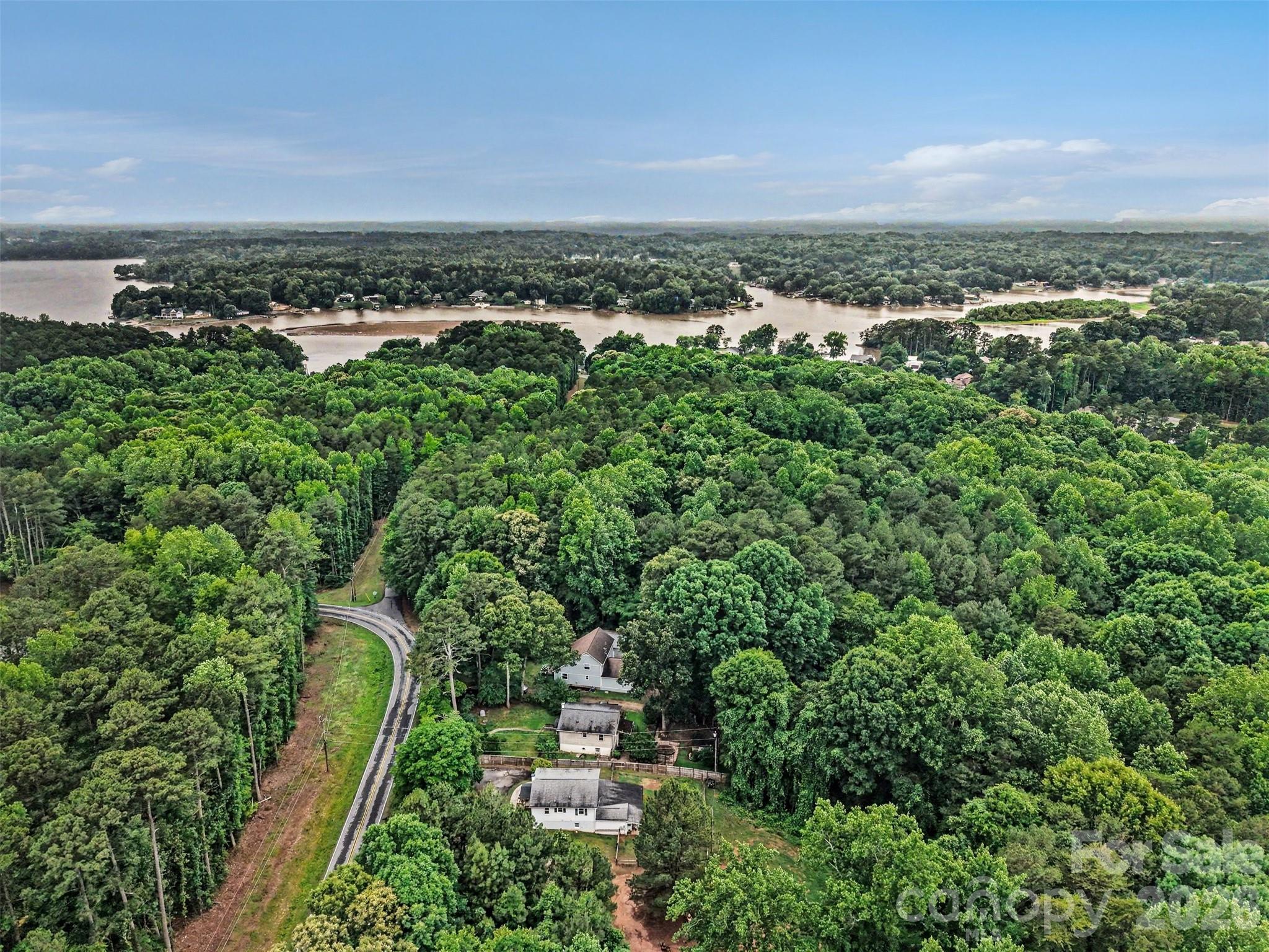 184 Canal Road Belmont, NC 28012 - Photo 18 of 39 an aerial view of a residential houses with outdoor space and trees