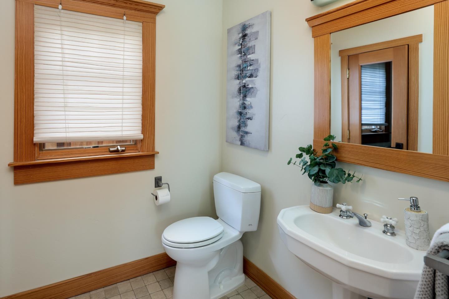 345 Berkeley Way Santa Cruz, CA 95062 - Photo 12 of 39 a bathroom with a toilet a sink and a mirror