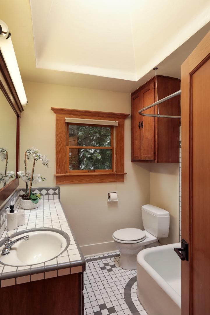 345 Berkeley Way Santa Cruz, CA 95062 - Photo 15 of 39 a bathroom with a sink toilet and mirror