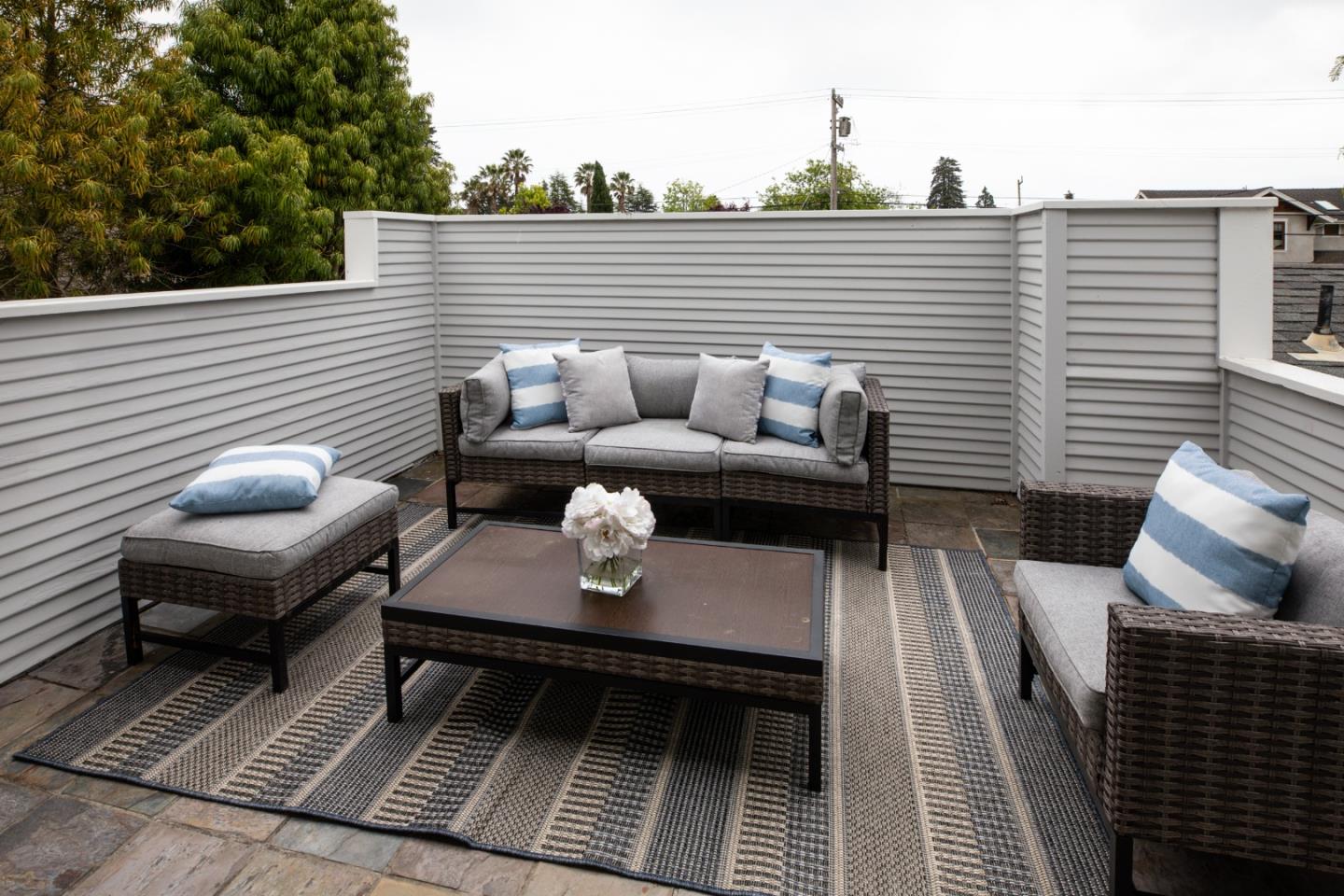 345 Berkeley Way Santa Cruz, CA 95062 - Photo 18 of 39 a view of a balcony with two chairs and a potted plant