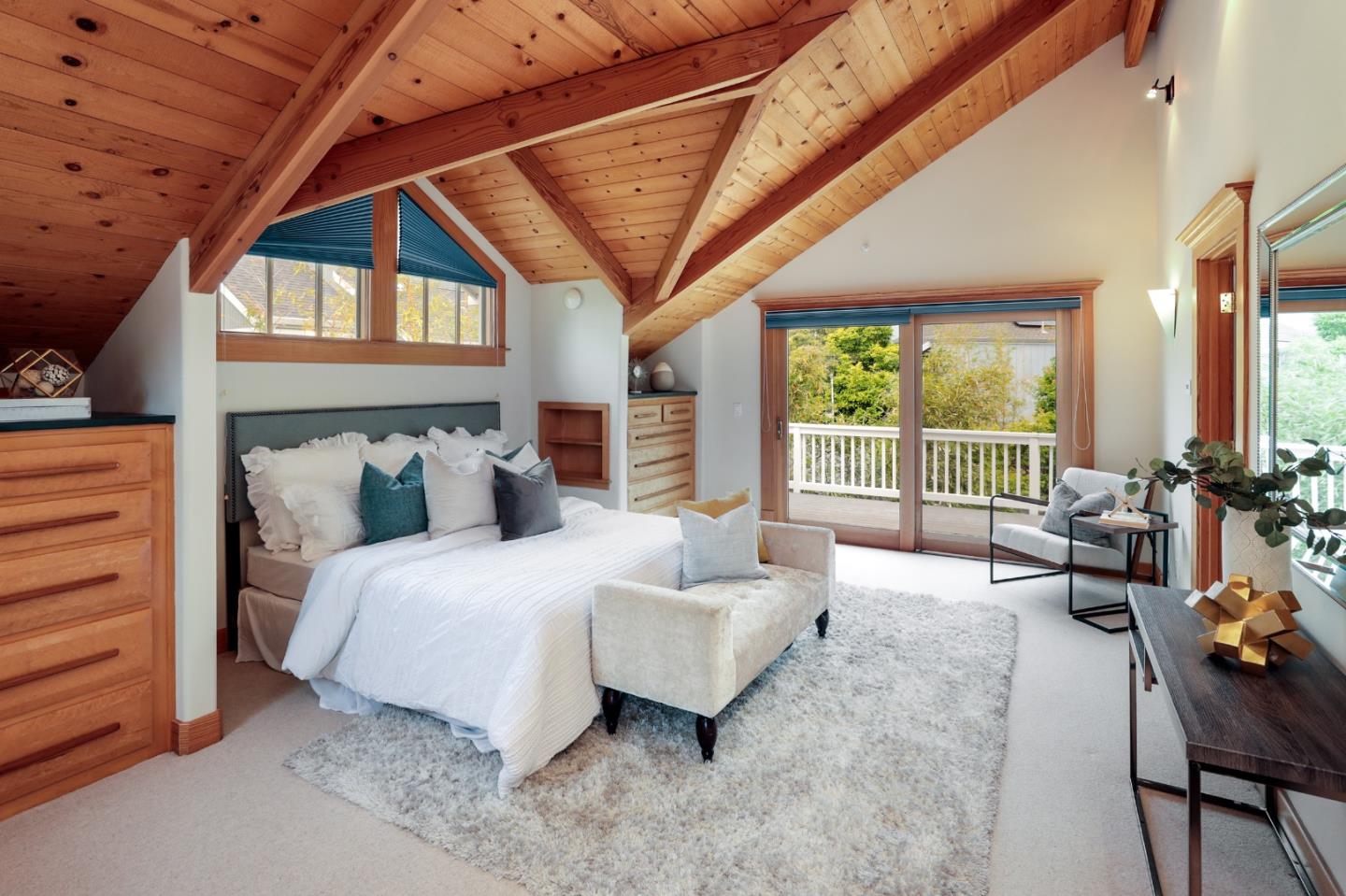 345 Berkeley Way Santa Cruz, CA 95062 - Photo 19 of 39 a spacious bedroom with a bed and a chandelier