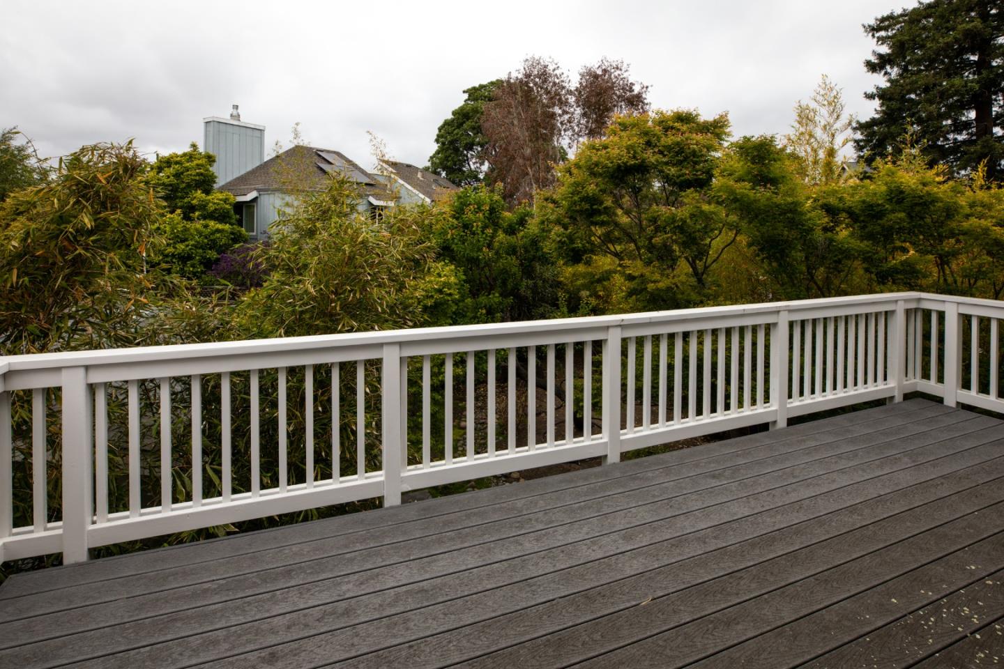 345 Berkeley Way Santa Cruz, CA 95062 - Photo 20 of 39 a balcony with wooden floor and fence