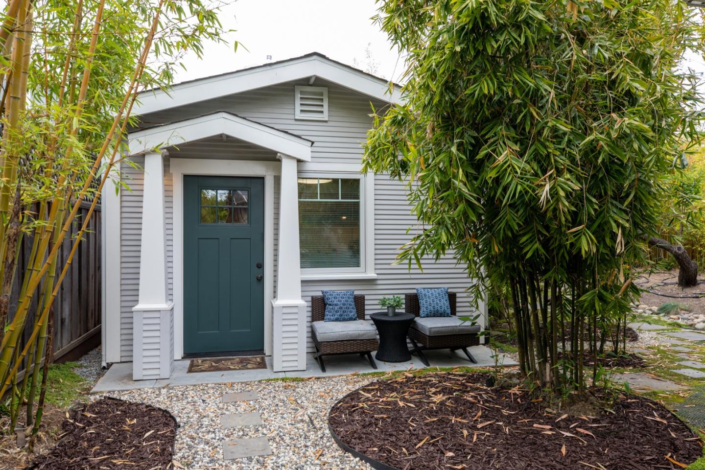 345 Berkeley Way Santa Cruz, CA 95062 - Photo 29 of 39 a view of a patio with table and chairs and potted plants