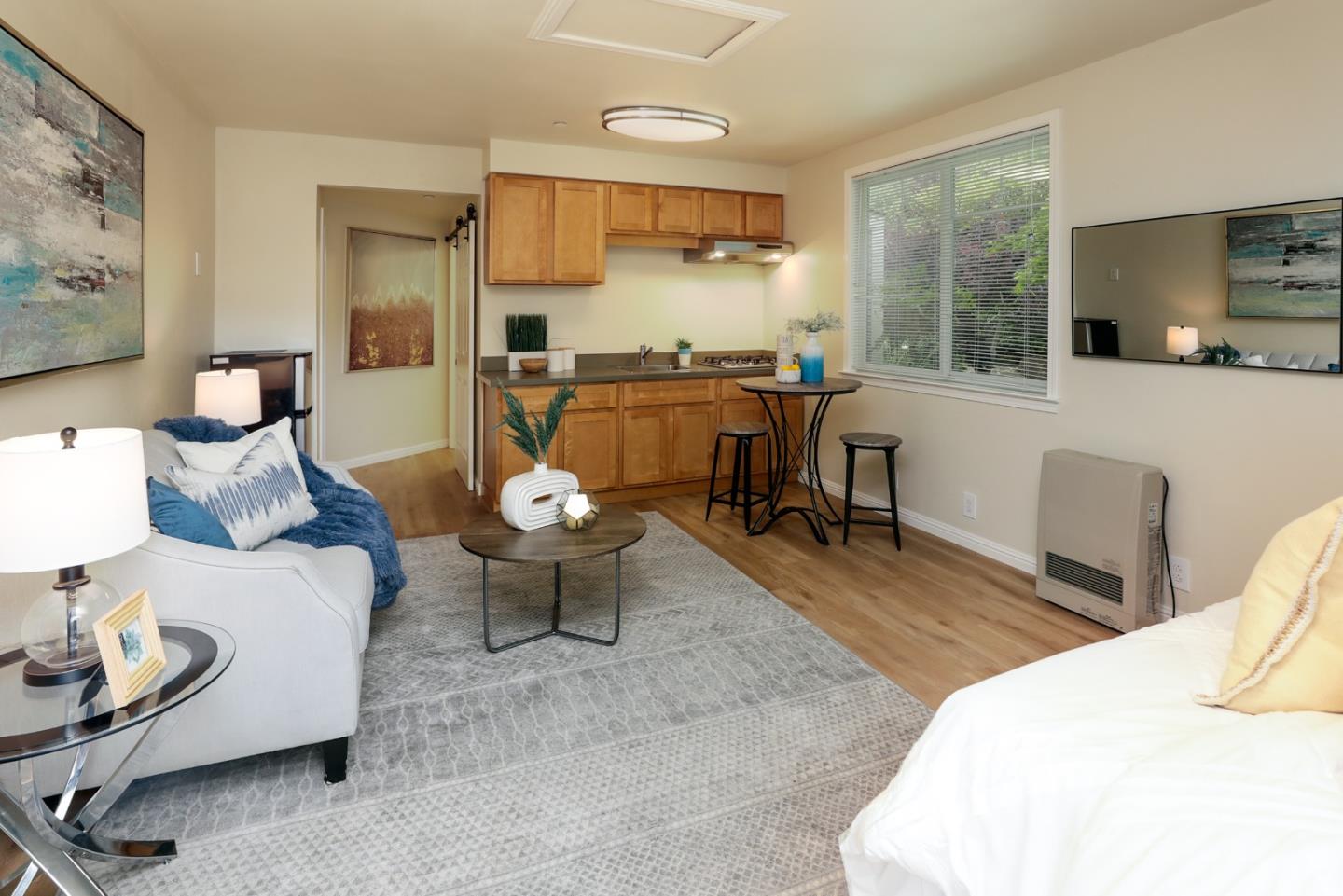 345 Berkeley Way Santa Cruz, CA 95062 - Photo 30 of 39 a living room with furniture and a large window