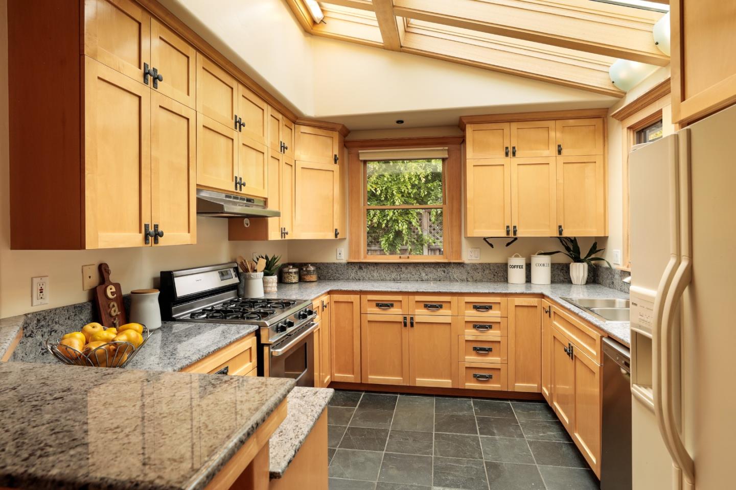 345 Berkeley Way Santa Cruz, CA 95062 - Photo 7 of 39 a kitchen with stainless steel appliances granite countertop a stove a sink and a microwave