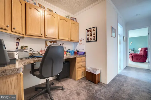 a kitchen with stainless steel appliances granite countertop a sink a stove and cabinets