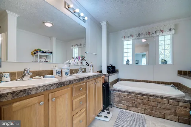 a bathroom with a shower and a glass door