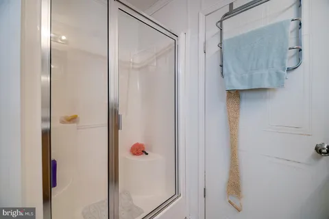 a bathroom with a sink a toilet and a shower curtain