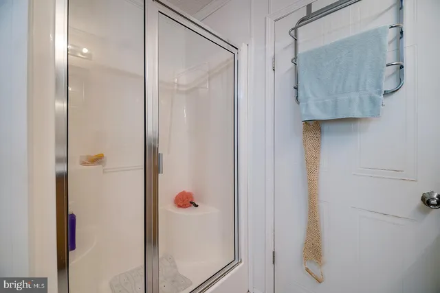 a bathroom with a sink a toilet and a shower curtain