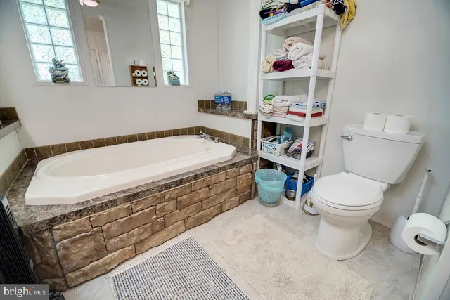 a view of a livingroom with furniture and a flat screen tv