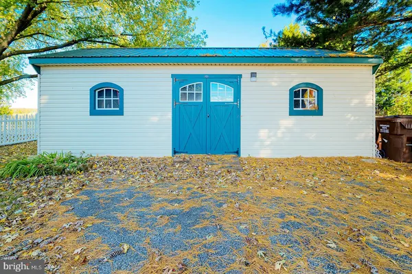 a view of a big yard with large trees