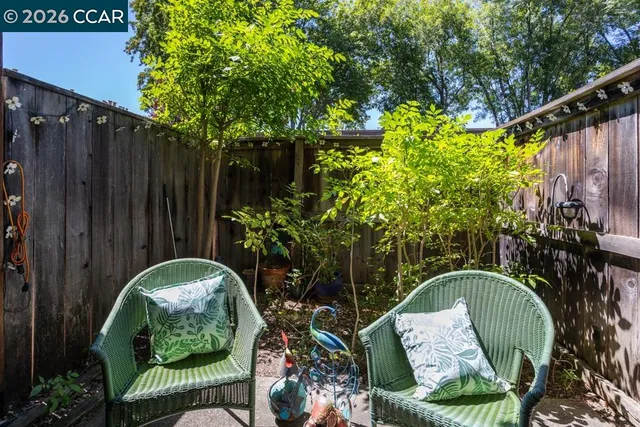 a backyard of a house with seating space