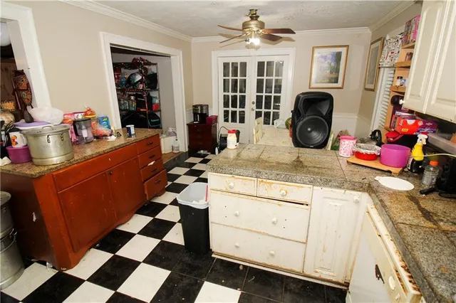 a kitchen with a sink stove and cabinets
