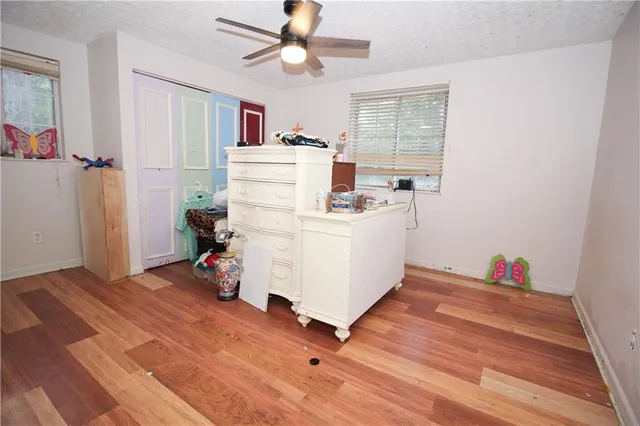 a bed room with a bed and a window