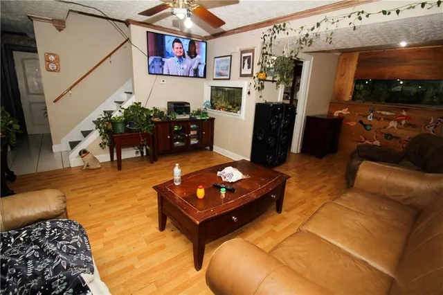 a living room with furniture and a flat screen tv