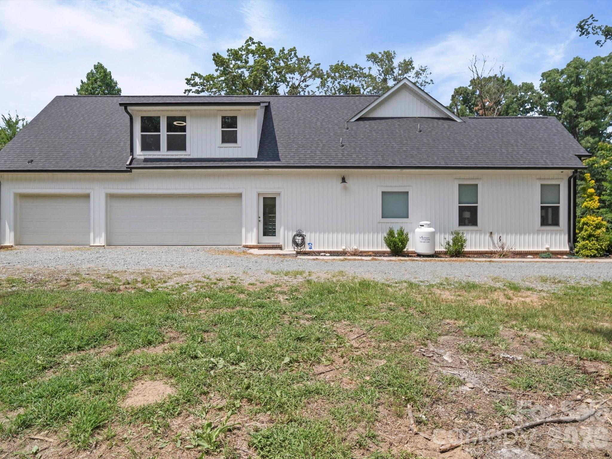 1421 Hamilton Crossroads Road Marshville, NC 28103 - Photo 11 of 29 a front view of a house with garden
