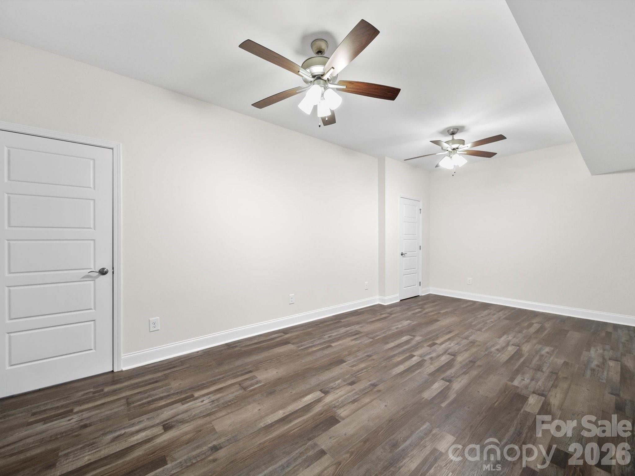 1421 Hamilton Crossroads Road Marshville, NC 28103 - Photo 18 of 29 a view of an empty room with a ceiling fan