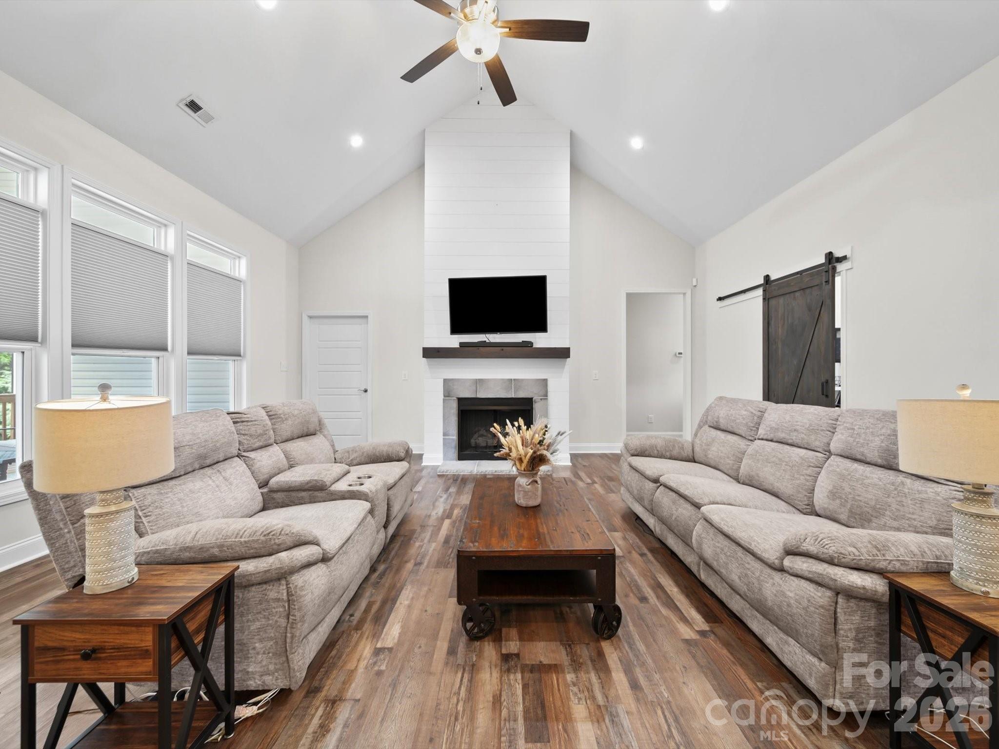 1421 Hamilton Crossroads Road Marshville, NC 28103 - Photo 5 of 29 a living room with furniture a fireplace and a flat screen tv