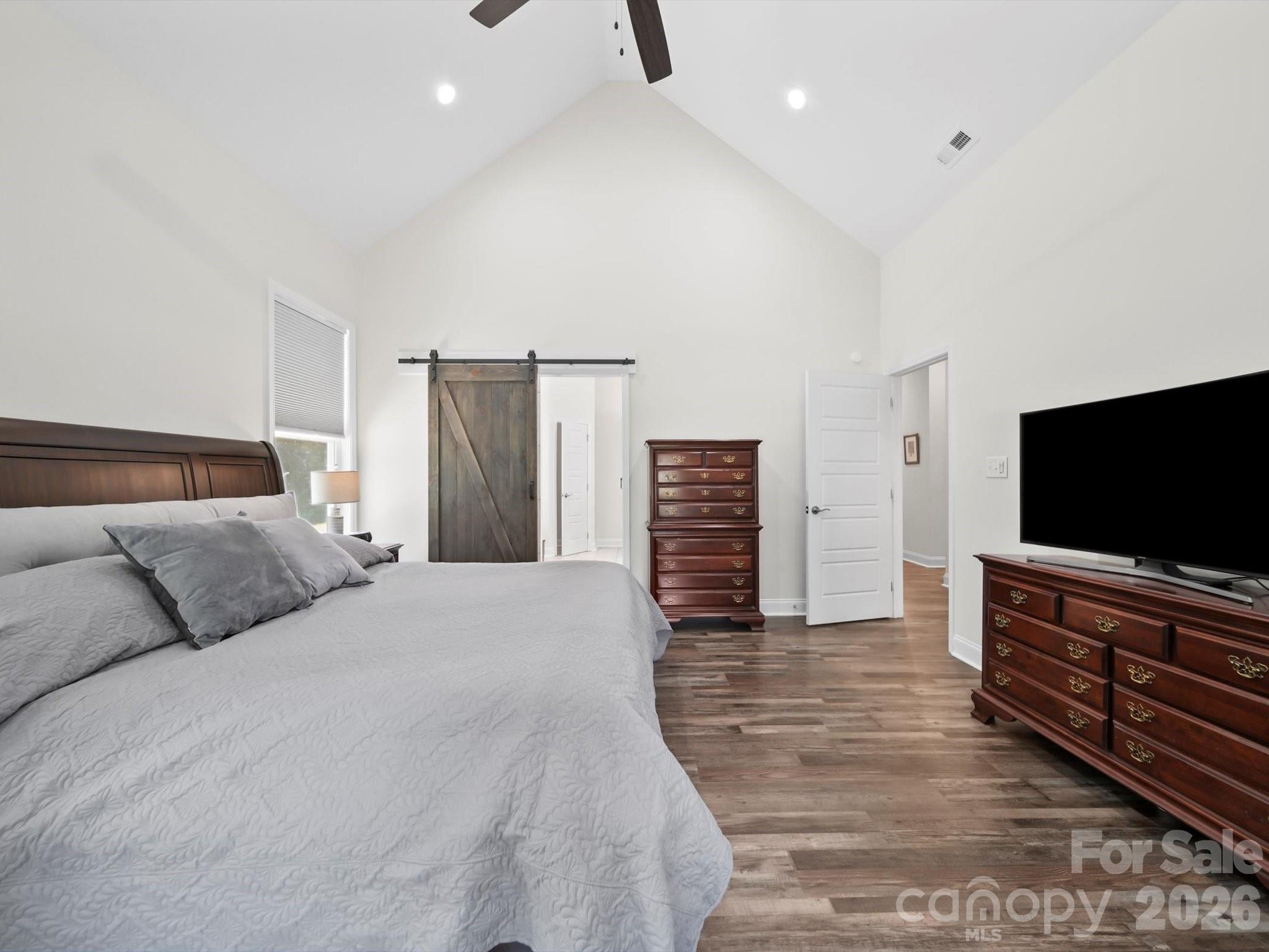 1421 Hamilton Crossroads Road Marshville, NC 28103 - Photo 8 of 29 a bedroom with furniture and a flat screen tv