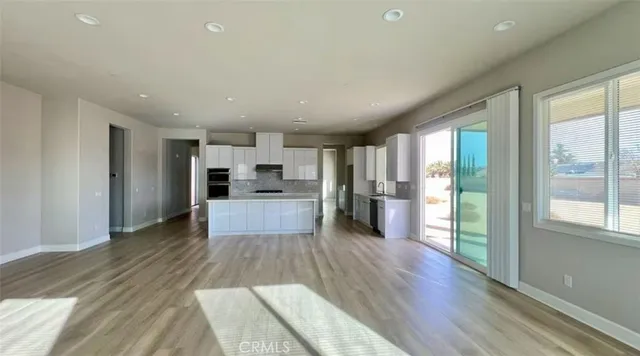 a view of kitchen with wooden floor