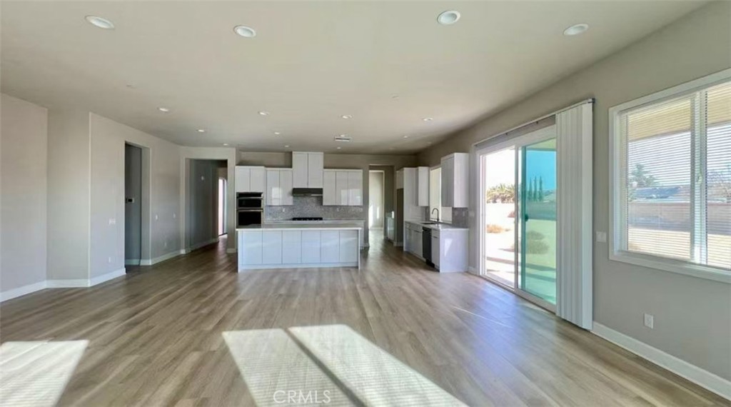 12925 Davona Dale Road Apple Valley, CA 92308 - Photo 4 of 14 a view of kitchen with wooden floor