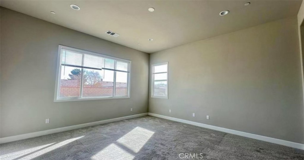 12925 Davona Dale Road Apple Valley, CA 92308 - Photo 9 of 14 an empty room with a window