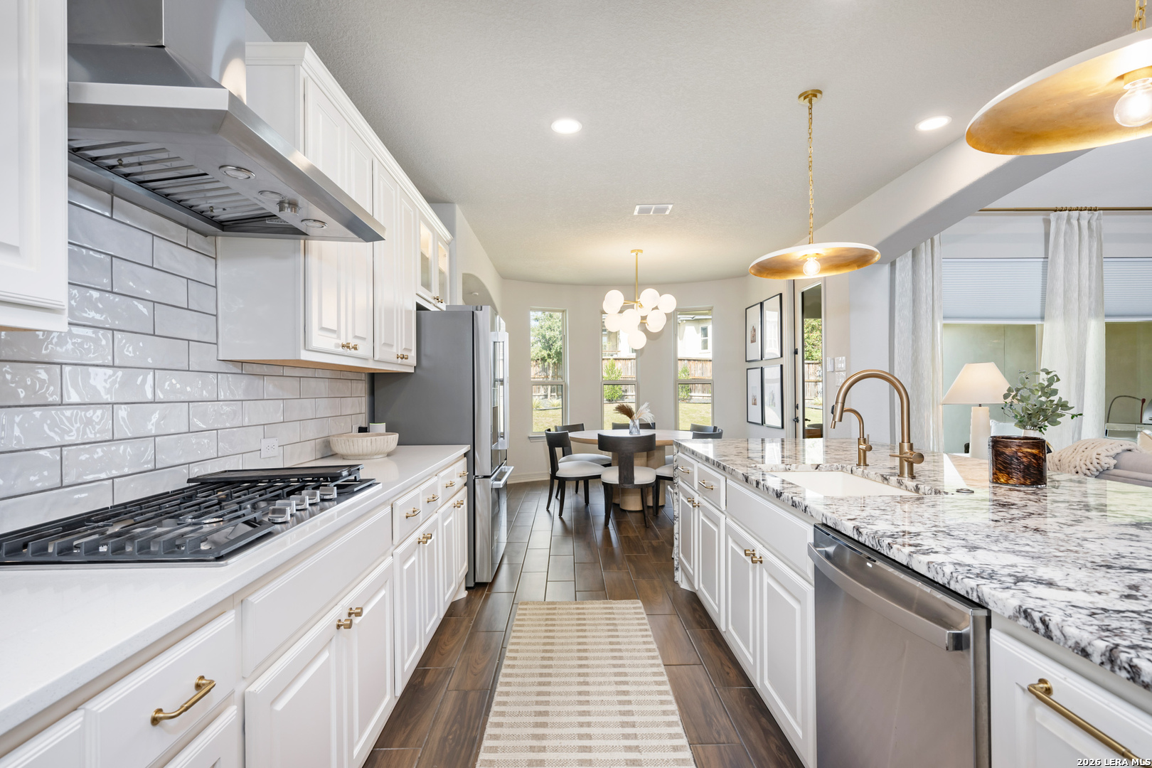 8527 Nichols Rim Boerne, TX 78015 - Photo 11 of 33 a kitchen with sink stove and cabinets