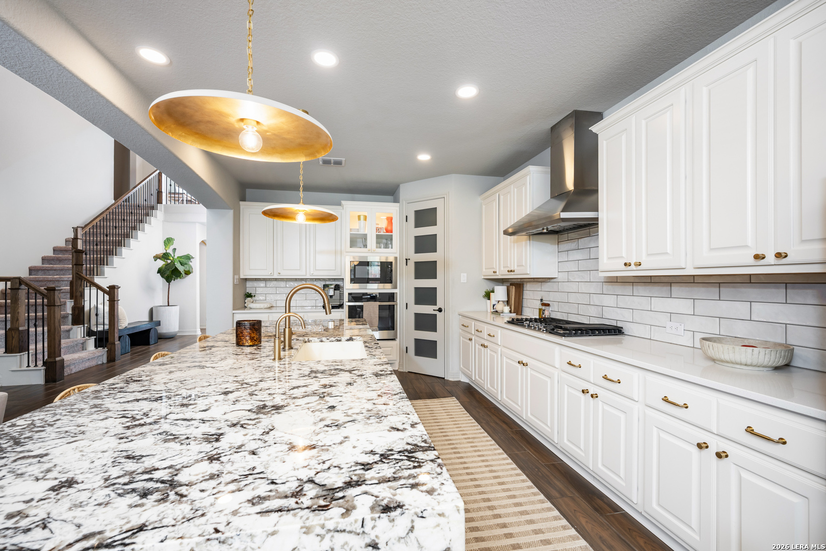 8527 Nichols Rim Boerne, TX 78015 - Photo 14 of 33 a kitchen with stainless steel appliances kitchen island granite countertop a sink and cabinets