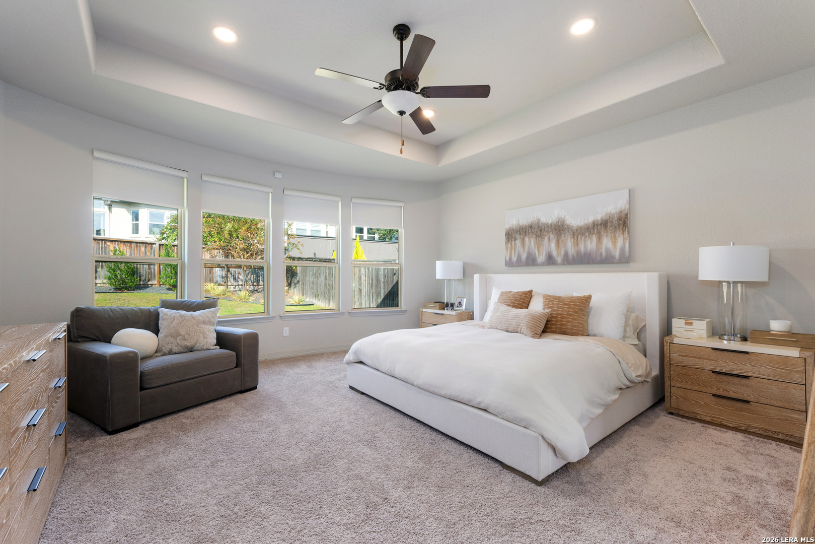 8527 Nichols Rim Boerne, TX 78015 - Photo 17 of 33 a bedroom with a bed couches and a large window