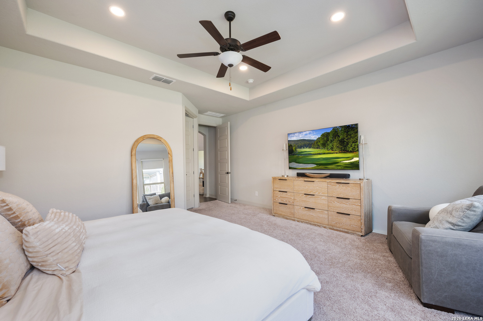 8527 Nichols Rim Boerne, TX 78015 - Photo 18 of 33 a bedroom with a bed and a flat screen tv