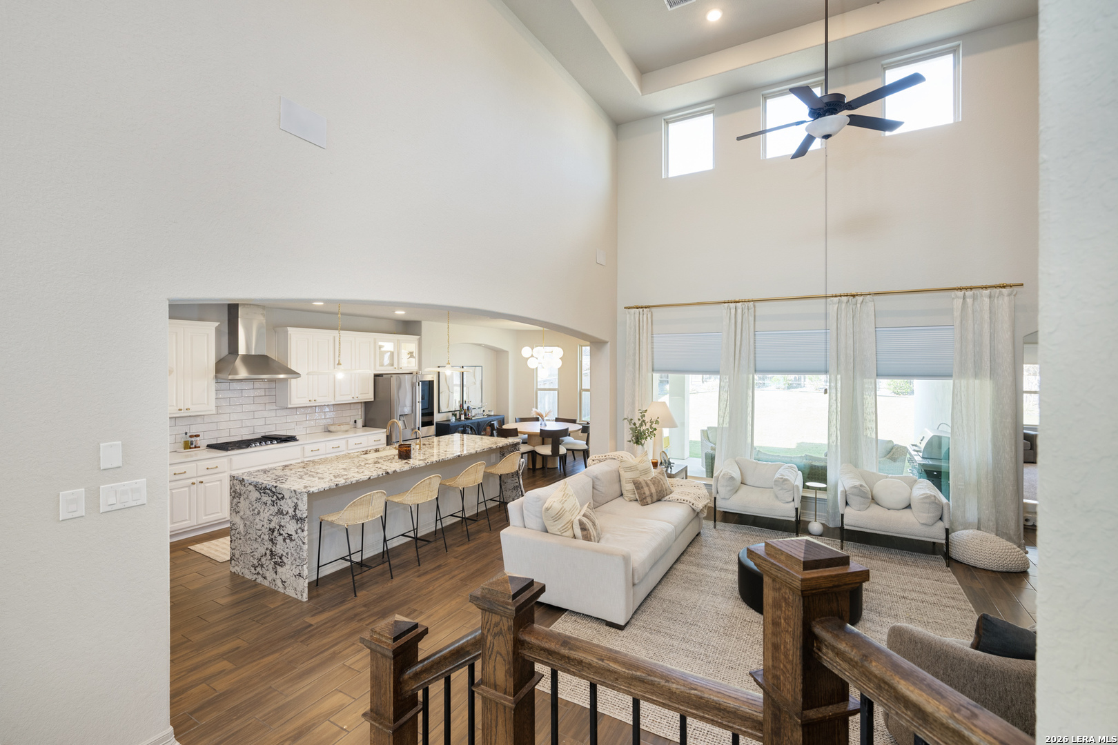 8527 Nichols Rim Boerne, TX 78015 - Photo 24 of 33 a living room with lots of furniture and a chandelier