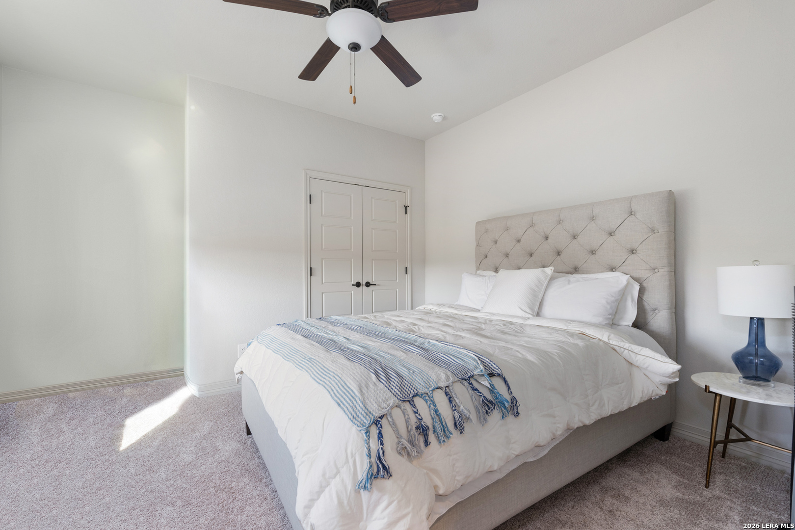 8527 Nichols Rim Boerne, TX 78015 - Photo 29 of 33 a bedroom with a bed and white cabinets