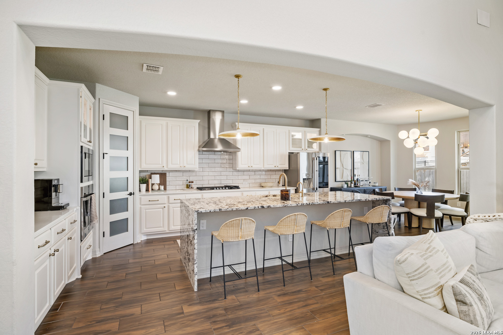 8527 Nichols Rim Boerne, TX 78015 - Photo 3 of 33 a large white kitchen with lots of counter space a sink and appliances